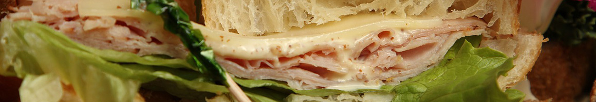 Eating Sandwich Bakery at Mason Jar restaurant in Cheney, WA.